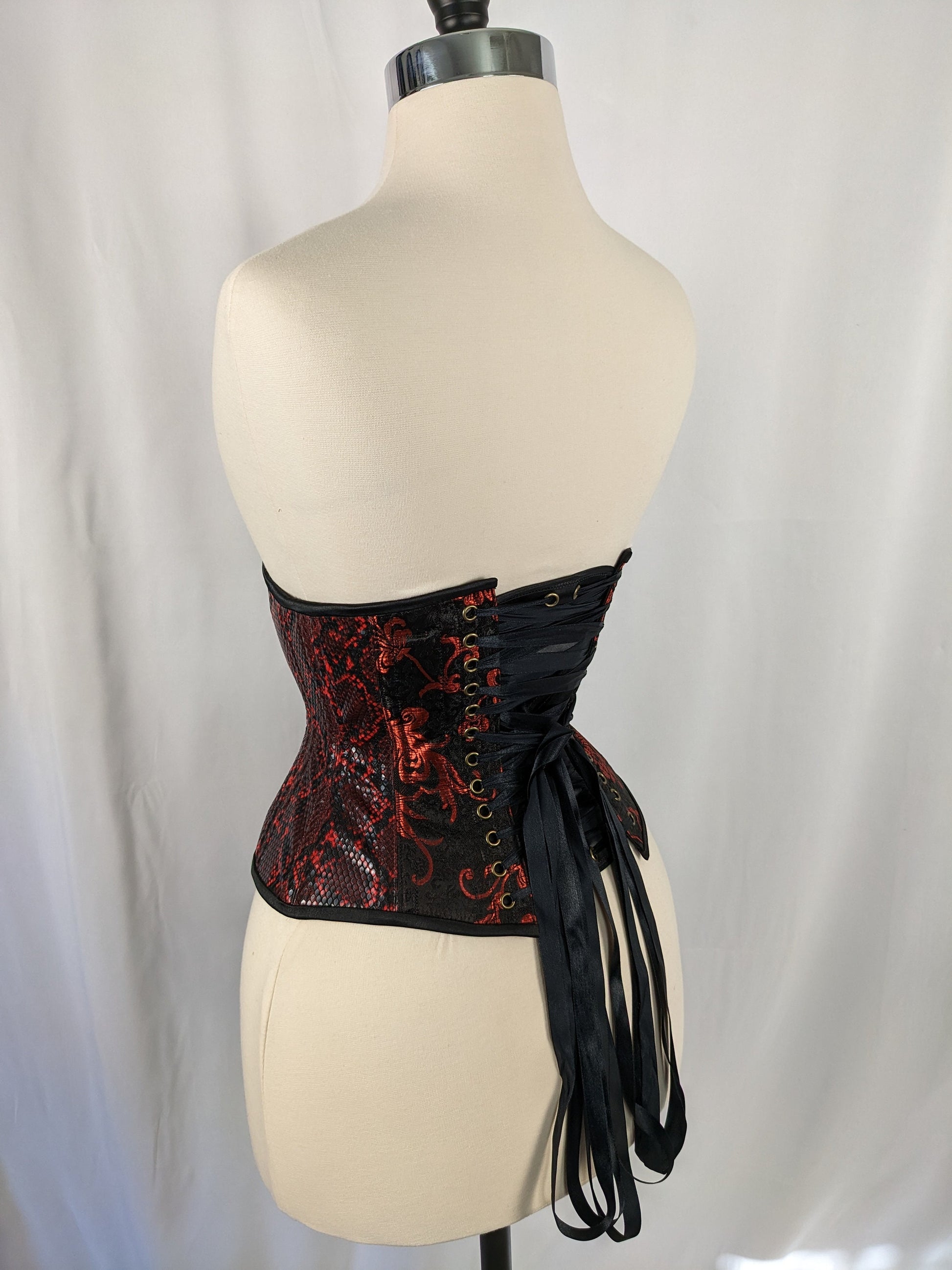 Red And Black Vinyl And Brocade Steel Boned Mid Hip Underbust Corset red-and-black-vinyl-and-brocade-steel-boned-mid-hip-underbust-corset